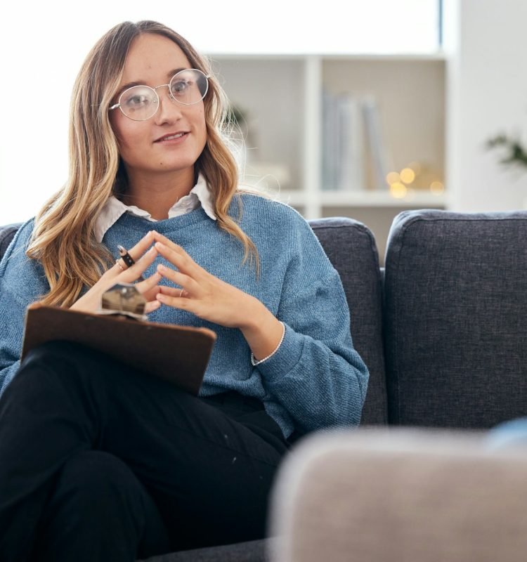 Counseling, therapy and woman therapist talking to client in a consultation or counseling conversat