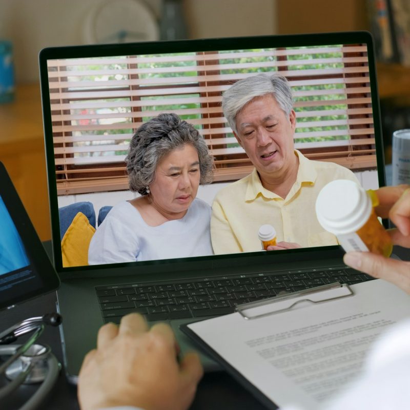 Telehealth concept,doctor video call with couple senior about prescription on digital tablet